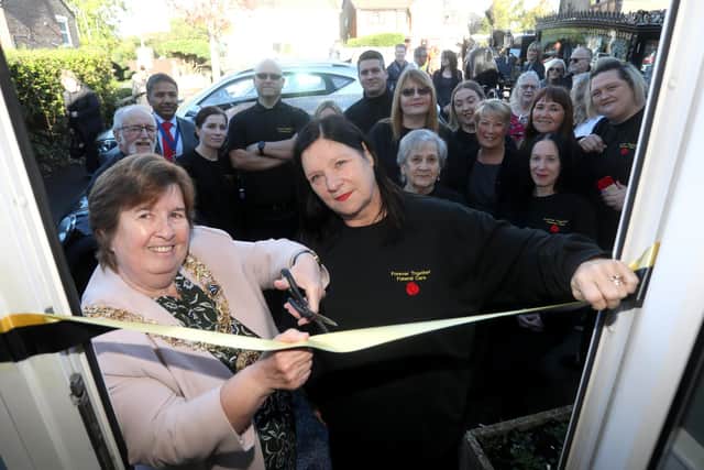 Cutting the ribbon on the new funeral parlour. Photograph by Sam Stephenson