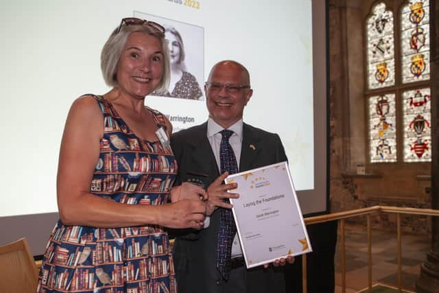 Sarah Warrington collects her Laying the Foundations Award