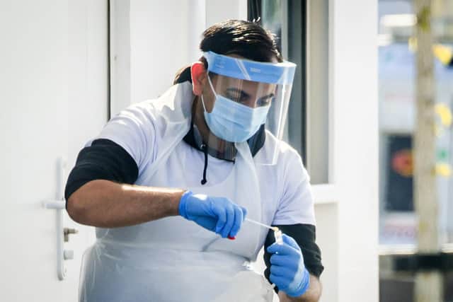 Swab samples being taken at a coronavirus test and trace centre.

Photo: Danny Lawson/PA Wire