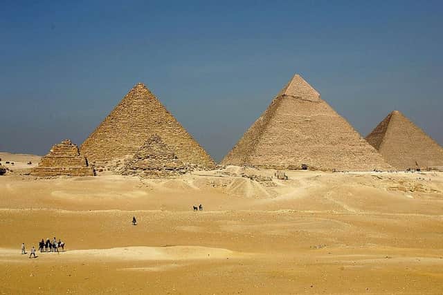 The three large pyramids at Giza are among Egypt's biggest tourist attractions.