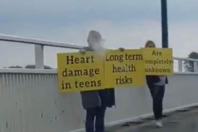 Protesters staged a bizarre anti-vaccine rally on a bridge into Hayling Island on Sunday.