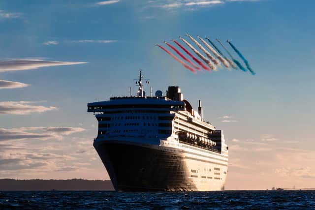 TARGET: The Red Arrows fly over Queen Mary 2 in the Solent in 2018. Picture Christopher Ison
