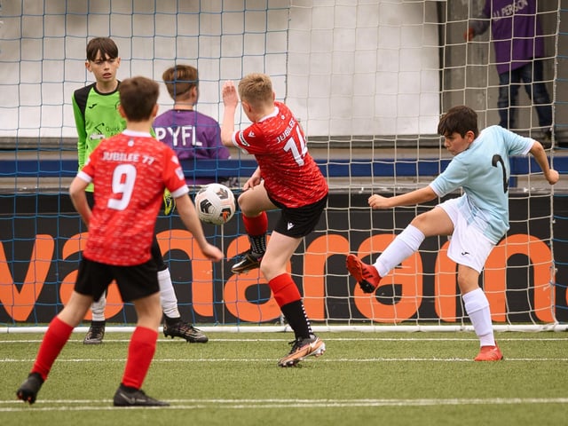 Action from the Portsmouth Youth League Geldard Invitation Cup final between Jubilee 77 U13s and Castle United U13s (light blue and white kit). Picture: Keith Woodland (190321-608)