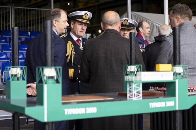 First Sea Lord Admiral Sir Ben Key speaks with Falklands veterans during a ceremony to name a new £15m ship repair barge at Portsmouth Naval Base