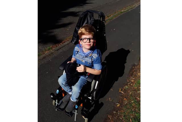 Ezra Meredith, four from Waterlooville, has been creating rainbow face masks with his mum Lucy Clilverd, to raise money for the NHS which has supported him with his cerebral palsy. Pictured here in his wheelchair, which he only uses occasionally