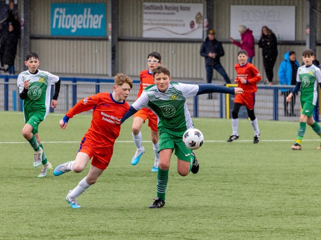 Action from the Under-13 Truman Challenge Cup final between Denmead Youth Lions (orange shirts) and Moneyfields Youth Yellow. Picture: Mike Cooter