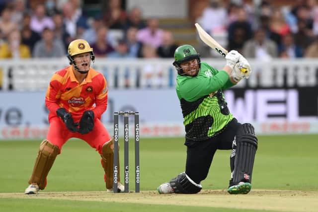 Brave batsman Paul Stirling hits out watched by Phoenix keeper Chris Benjamin during The Hundred Final. Photo by Stu Forster/Getty Images.