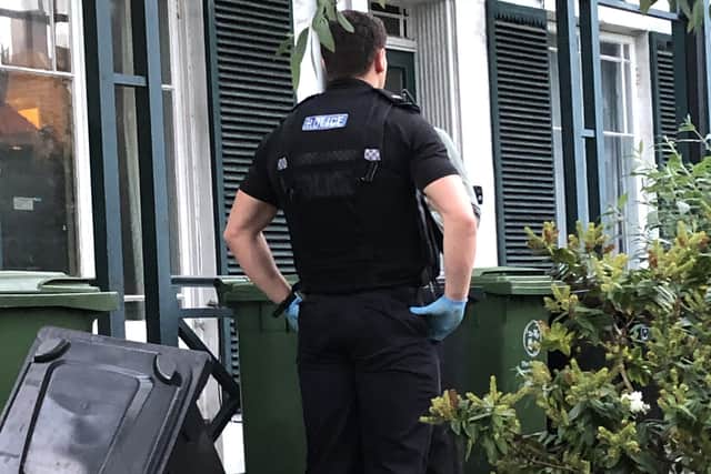 Police pictured outside a property in North End. Photo: Tom Cotterill