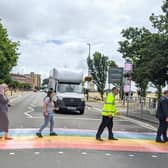 A colourful rainbow crossing has been created on Duisburg Way by Portsmouth City Council to celebrate the city's LGTBQ+ community. Traffic boss Cllr Lynne Stagg, LGBTQ+ champion Cllr Claire Udy, Tally Aslam from Portsmouth Pride, Ray Muscat from Colas and Cllr Steve Pitt