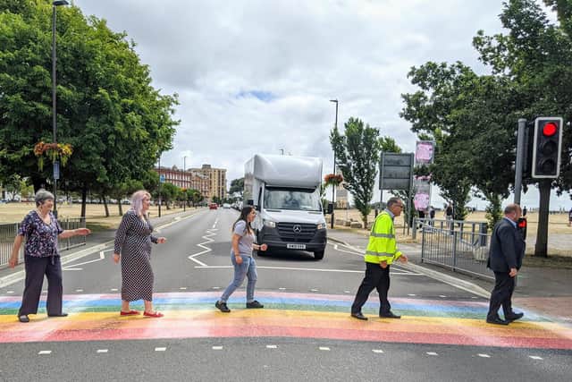 A colourful rainbow crossing has been created on Duisburg Way by Portsmouth City Council to celebrate the city's LGTBQ+ community. Traffic boss Cllr Lynne Stagg, LGBTQ+ champion Cllr Claire Udy, Tally Aslam from Portsmouth Pride, Ray Muscat from Colas and Cllr Steve Pitt