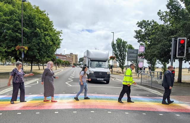A colourful rainbow crossing has been created on Duisburg Way by Portsmouth City Council to celebrate the city's LGTBQ+ community. Traffic boss Cllr Lynne Stagg, LGBTQ+ champion Cllr Claire Udy, Tally Aslam from Portsmouth Pride, Ray Muscat from Colas and Cllr Steve Pitt