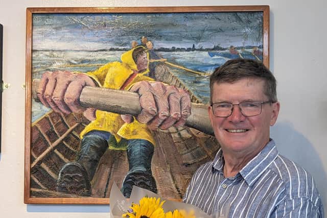Tom Bennett with his prize-winning painting, The Rhythm of Stroke
