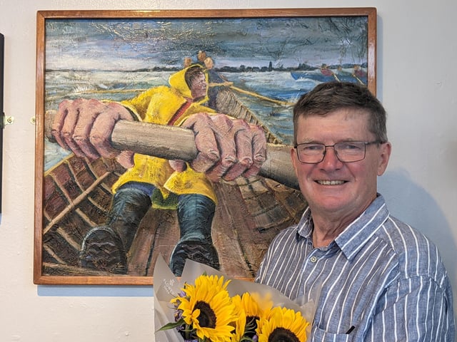 Tom Bennett with his prize-winning painting, The Rhythm of Stroke