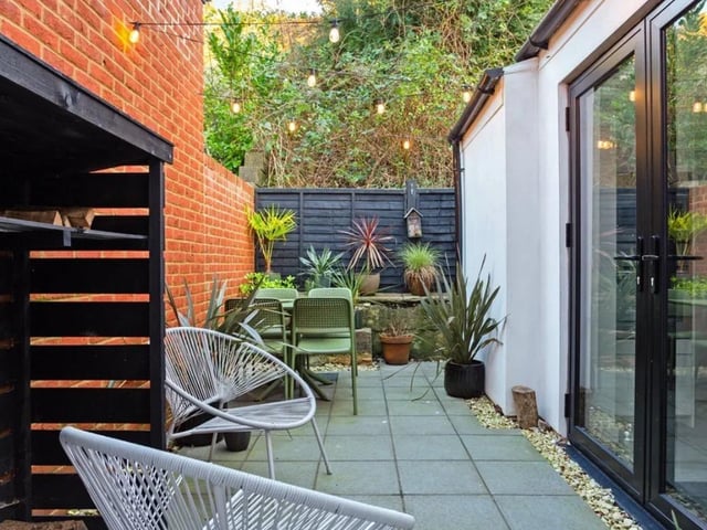 The listing says:" From a welcoming entrance, the ground floor accommodation is arranged between two reception rooms; a living room and a dining room, which is then separated by a lovely feature of a wood burning stove fireplace."