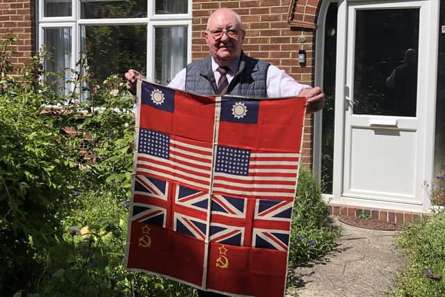 Proud Tony Simms, 81, of Military Road, Hilsea, holding the flag he last displayed during VE Day on May 8, 1945.