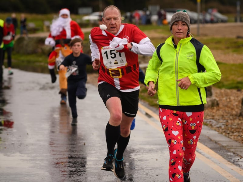 Two runners make a charge for the finish line at the Christmas Pud 5k, Stokes Bay, Gosport