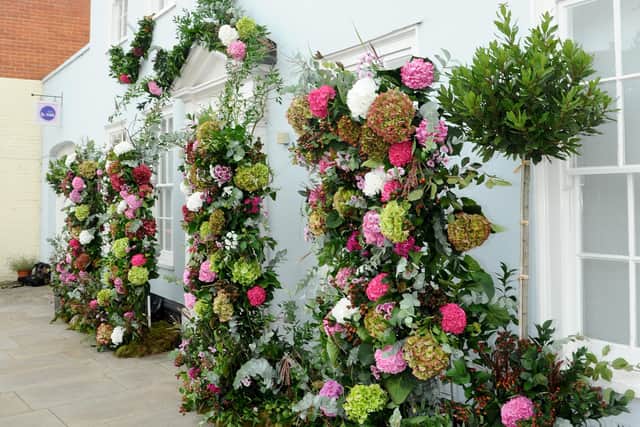 The Breast Cancer Haven, Wessex with a flower wall created by florist Susie Babington 
Picture: Sarah Standing (180726-5308)