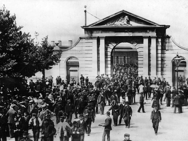 Workers leaving for the day at Portsmouth Dockyard's Unicorn Gate about 1910. Picture: costen.co.uk