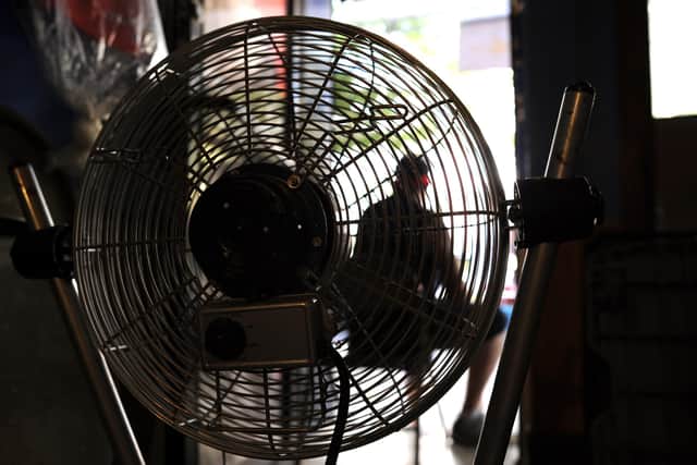 Should you sleep with a fan on? Picture: TIMOTHY A. CLARY/AFP via Getty Images