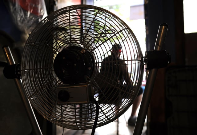Should you sleep with a fan on? Picture: TIMOTHY A. CLARY/AFP via Getty Images
