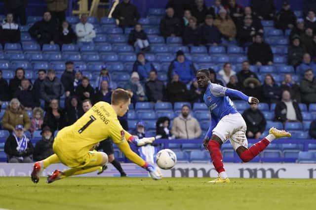 MK Dons goalkeeper Jamie Cumming saves from Jay Mingi during Pompey's 3-2 success in Saturday's FA Cup encounter. Picture: Jason Brown/ProSportsImages