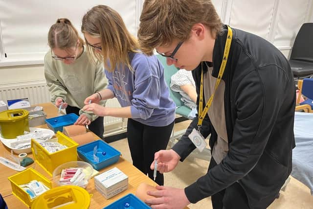 Students learn how to inject vaccines