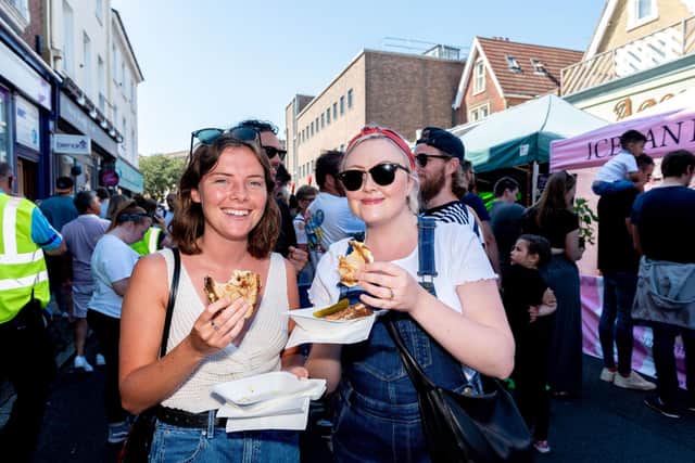 Southsea Food Festival at Palmerston Road, Southsea - Rachel Tatton and Ciara Emery enjoy their French Connection cheese toasties. Picture: Vernon Nash (200719-011)
