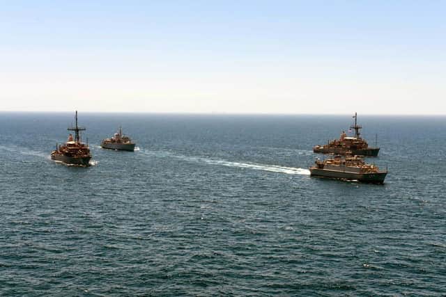 HMS Brocklesby follows Saudi minehunter Al Shaqra, front, flanked by two US Avenger-class minehunters
