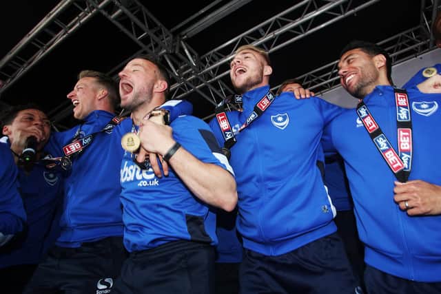 League Two title-winners Kyle Bennett, Carl Baker, Noel Hunt, Jack Whatmough and Danny Rose celebrate on Southsea Common in May 2017. Picture: Joe Pepler