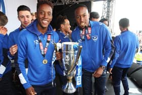 Just three-and-a-half months after quitting his job at a car rental firm, Nicke Kabamba (right) won the League Two title. Picture: Joe Pepler