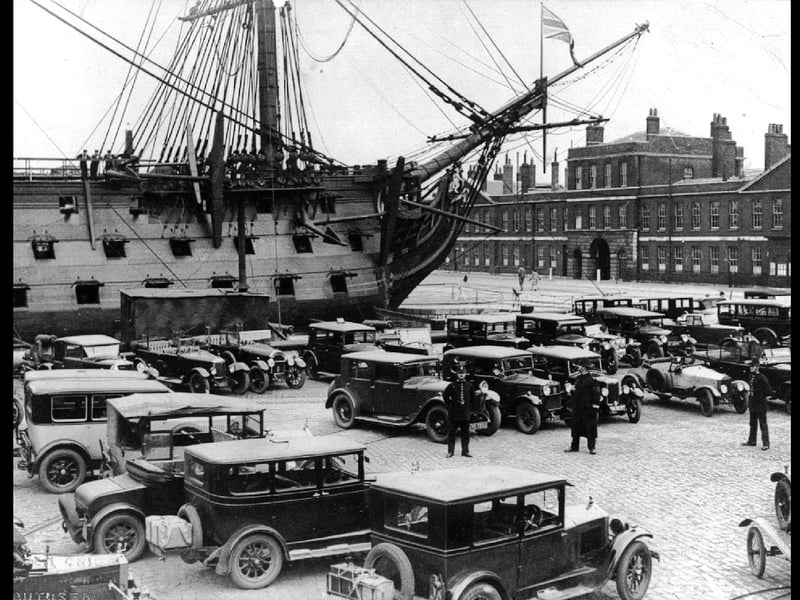 Luggage on the back of the cars with police standing guard. I wonder what was going on here around HMS Victory in Portsmouth Dockyard during the 1920s?