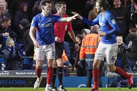 John Marquis (left) has been recalled to Pompey's side following his Exeter heroics. Picture: Barry Zee