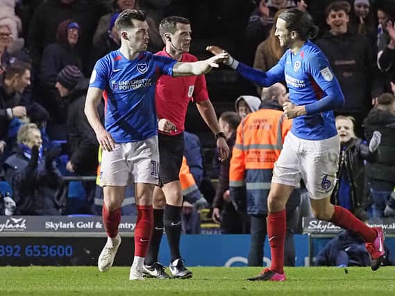 John Marquis (left) has been recalled to Pompey's side following his Exeter heroics. Picture: Barry Zee