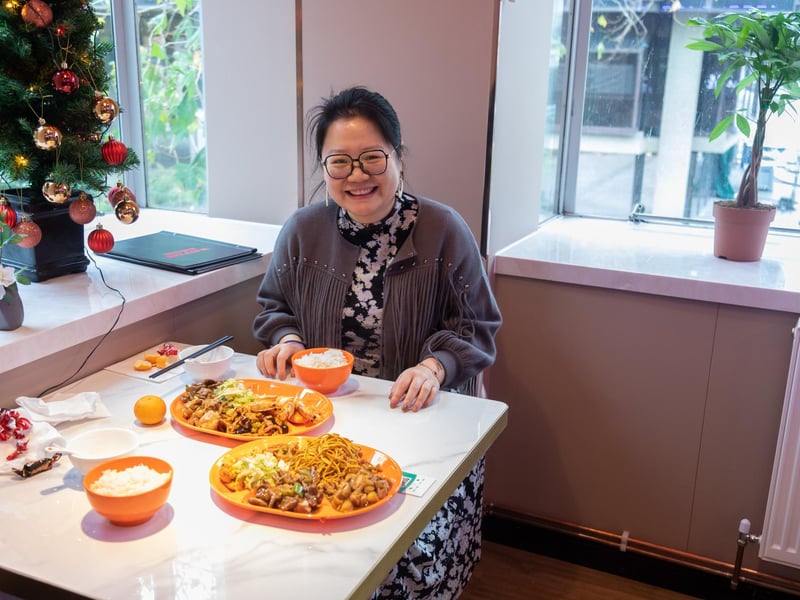 Customer Summer Wang (41) at enjoying her meal at the opening of the newly relocated Mayfair Chinese Restaurant in Guildhall Square. Picture: Mike Cooter (081224)
