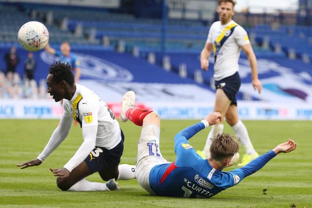 Ronan Curtis went down in stoppage-time after a coming together with Dan Agyei but wasn't awarded a penalty. Picture: Joe Pepler