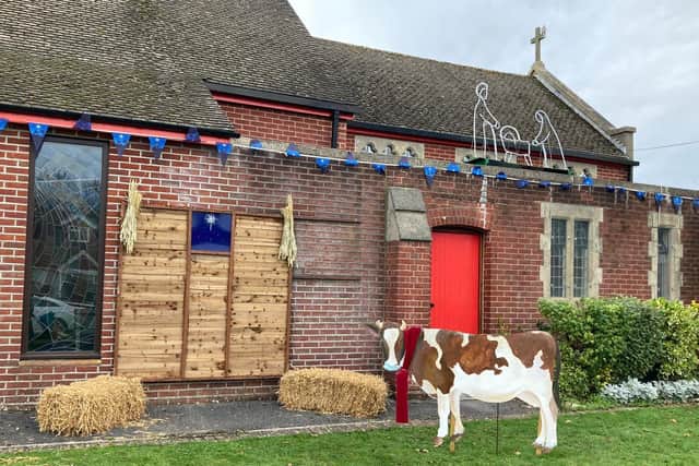 A Christmas trail has popepd up in Cowplain to raise funds for Padnell Infant School. Pictured: St Wilfrid's Church Spot The Difference display which will have a new item every day of advent