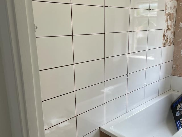 Works undertaken to a bathroom. Bradley Willis-Chambers informed the complainant that the wall was rotten and needed to come down. Instead, Bradley Willis-Chambers tiled over the wall in attempt to defraud the customer.
