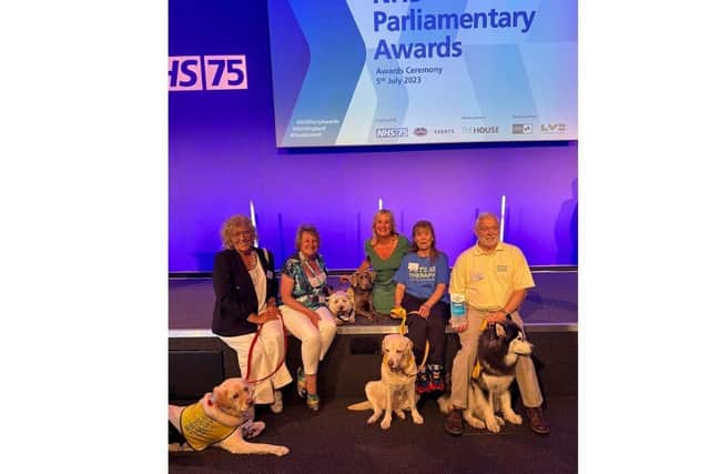 Pets As Therapy team has received the Volunteer Award at the NHS Awards.
Pictured: (Right to left) Snowy and Steven, Whiskey and Lesley, Maggie & Mollie and Tess, Louis and Madeleine