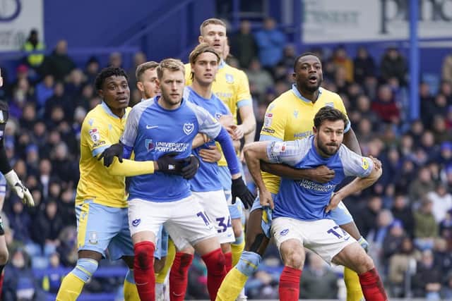 Joe Rafferty and Joe Pigott jostle inside Sheffield Wednesday's box in anticipation of a Pompey corner. Picture: Jason Brown/ProSportsImages