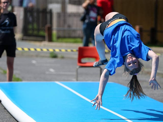 Aurora Williams, 15, of Viva Gymanstics, demonstrates her skills.