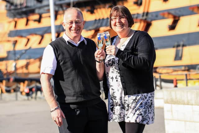 Sharon and John Hall in front of HMS Victory. Picture: Camelot