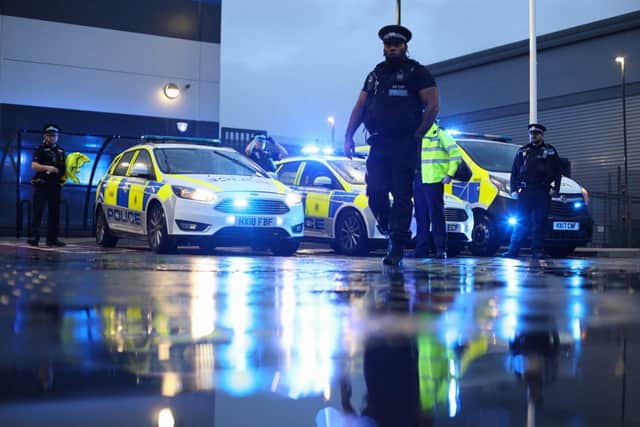 Library image of Portsmouth police officers on duty at night.