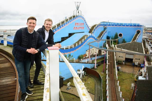 Pompey face King's Lynn on Saturday. The Linnet's defender Aaron Jones, left, is pictured with his brother at the family's Great Yarmouth Pleasure Beach business. He also has family in Portsmouth