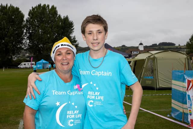 Alison Fenton and Max Fenton walking the Relay for Life with the Rocky Rockies, part of the Rock Choir at the Cancer Research UK Relay for Life on St Johns College playing fields on the 25th September 2021. Photo by Alex Shute