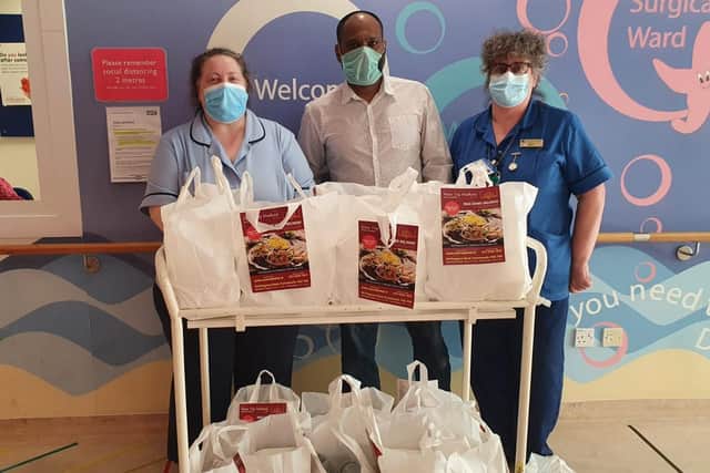 New Taj Mahal Indian takeaway in Buckland donated Iftar meals to Portsmouth hospitals as part of their charitable giving for Ramadan and to give thanks to key workers. Pictured: Salim Miah with staff on Starfish children's ward at Queen Alexandra Hospital