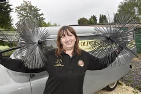 Susan Oliver (48) from Denmead, owns a 1959 Bedford CA van called Nancy which she operates her business Oliver Chimney Sweep from. 

Picture: Sarah Standing (140723-6687)