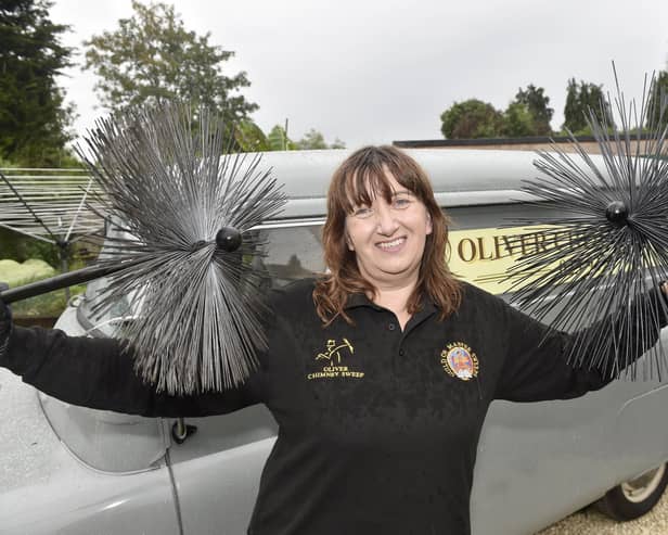 Susan Oliver (48) from Denmead, owns a 1959 Bedford CA van called Nancy which she operates her business Oliver Chimney Sweep from. 

Picture: Sarah Standing (140723-6687)