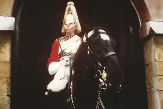 A young Peter Sims, serving as a trooper in The Queen's Lifeguards, a regiment of the Household Cavalry.