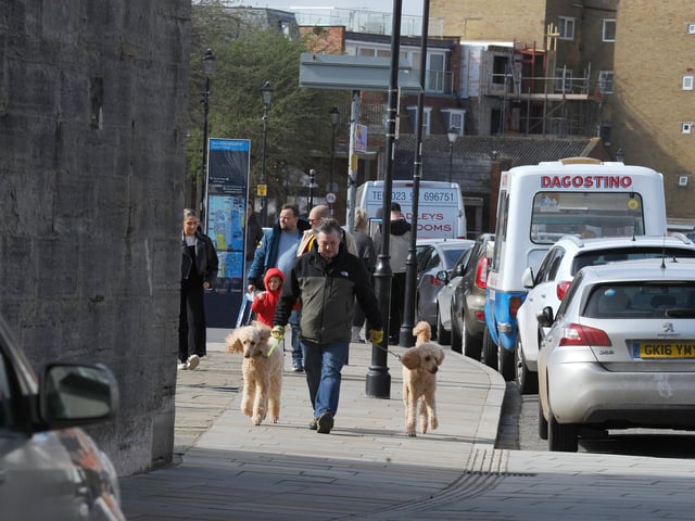 Despite the wind many people enjoyed the sunshine in Old Portsmouth on Good FridayPicture: Sarah Standing (290324-7044)