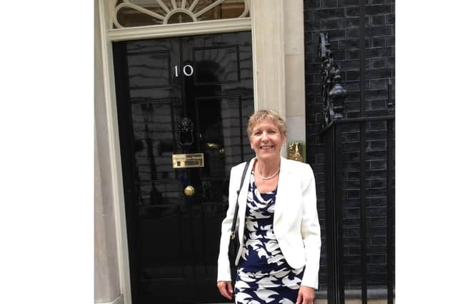 Dr Barbara Rushton standing outside number 10.